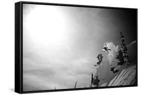 A Young Male Skier Jumps Off the Side of a Mountain at Alta, Utah-Adam Barker-Framed Stretched Canvas
