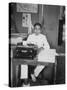 A Young Man Sitting at a Typewriter, Indonesia, 20th Century-null-Stretched Canvas