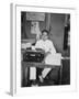 A Young Man Sitting at a Typewriter, Indonesia, 20th Century-null-Framed Photographic Print