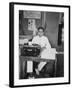 A Young Man Sitting at a Typewriter, Indonesia, 20th Century-null-Framed Photographic Print