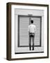 A Young Man Standing in the Street Looking at a Pair of Doors-India Hobson-Framed Photographic Print