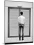 A Young Man Standing in the Street Looking at a Pair of Doors-India Hobson-Mounted Photographic Print