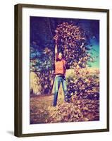 A Young Man Throwing Leaves in the Air-graphicphoto-Framed Photographic Print