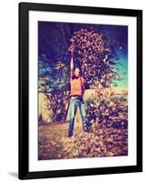 A Young Man Throwing Leaves in the Air-graphicphoto-Framed Photographic Print