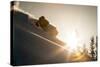 A Young Skier Chases the Sun Down the Ski Slope in the Wasatch Backcountry, Utah-Louis Arevalo-Stretched Canvas
