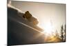 A Young Skier Chases the Sun Down the Ski Slope in the Wasatch Backcountry, Utah-Louis Arevalo-Mounted Photographic Print