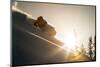A Young Skier Chases the Sun Down the Ski Slope in the Wasatch Backcountry, Utah-Louis Arevalo-Mounted Photographic Print
