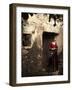 A Young Spanish Woman Wearing Traditional Flamenco Dress Standing in a Doorway to an Old Building-Steven Boone-Framed Photographic Print