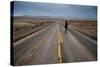 A Young Woman Approaching the Rocky Mountain Front, Teton County, Montana-Steven Gnam-Stretched Canvas