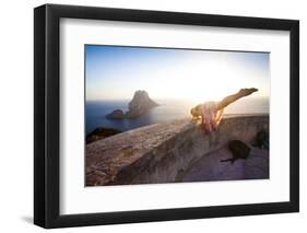 A Young Woman Does an Acrobatic Yoga Pose at the Torre Des Savinar Lookout Tower in Sw Ibiza-Day's Edge Productions-Framed Photographic Print