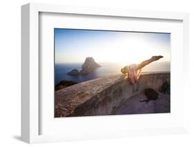 A Young Woman Does an Acrobatic Yoga Pose at the Torre Des Savinar Lookout Tower in Sw Ibiza-Day's Edge Productions-Framed Photographic Print