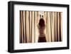 A Young Woman is Opening the Curtains at Sunrise-lolostock-Framed Photographic Print