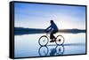 A Young Woman Rides Her Mountain Bike on the Flooded Salt Pan of the Salar De Uyuni in Sw Bolivia-Sergio Ballivian-Framed Stretched Canvas