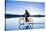 A Young Woman Rides Her Mountain Bike on the Flooded Salt Pan of the Salar De Uyuni in Sw Bolivia-Sergio Ballivian-Stretched Canvas