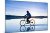 A Young Woman Rides Her Mountain Bike on the Flooded Salt Pan of the Salar De Uyuni in Sw Bolivia-Sergio Ballivian-Mounted Photographic Print