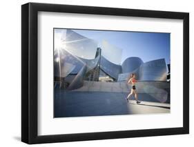 A Young Woman Runs at the Walt Disney Concert Hall in Downtown Los Angeles, California-Carlo Acenas-Framed Photographic Print