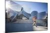 A Young Woman Runs at the Walt Disney Concert Hall in Downtown Los Angeles, California-Carlo Acenas-Mounted Photographic Print