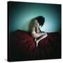 A Young Woman Sat on a Red Bed Sheet-Rafal Bednarz-Stretched Canvas