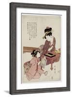 A Young Woman Seated at a Desk, Writing, a Girl with a Book Looks On-Kitagawa Utamaro-Framed Giclee Print