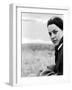 A Young Woman Sitting Near the Sea Wearing a Thick Jumper-RedHeadPictures-Framed Photographic Print