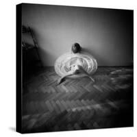 A Young Woman Sitting on a Pargued Floor-Rafal Bednarz-Stretched Canvas