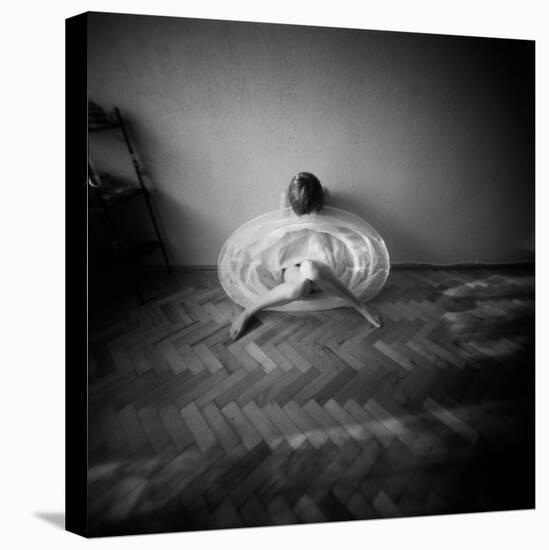 A Young Woman Sitting on a Pargued Floor-Rafal Bednarz-Stretched Canvas