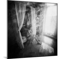 A Young Woman Smoking a Cigarette Seated in the Sunlight Shining through a Window-Rafal Bednarz-Mounted Photographic Print