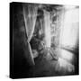 A Young Woman Smoking a Cigarette Seated in the Sunlight Shining through a Window-Rafal Bednarz-Stretched Canvas