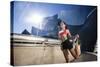 A Young Woman Stretches at the Walt Disney Concert Hall in Downtown Los Angeles, California-Carlo Acenas-Stretched Canvas