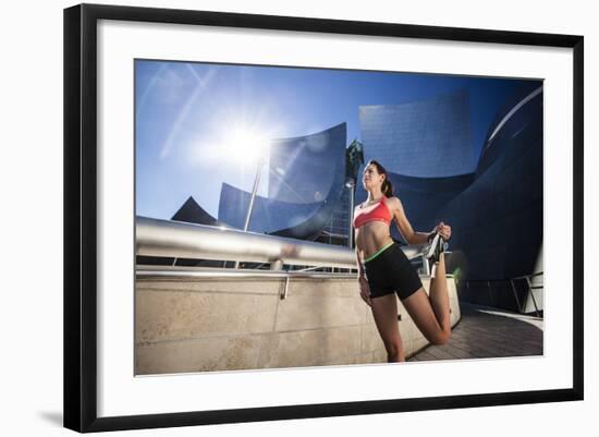 A Young Woman Stretches at the Walt Disney Concert Hall in Downtown Los Angeles, California-Carlo Acenas-Framed Photographic Print