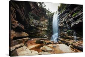 A Young Woman Stretches under Cachoeira Mosquito in Chapada Diamantina National Park-Alex Saberi-Stretched Canvas