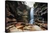 A Young Woman Stretches under Cachoeira Mosquito in Chapada Diamantina National Park-Alex Saberi-Stretched Canvas