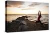 A Young Woman Welcomes the Sun by Practicing Yoga at Ausable Beach, Lake Champlain, New York-Louis Arevalo-Stretched Canvas