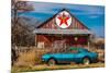 Abandoned blue Camaro Chevrolete in front of deserted Texaco Station, remote part of Nebraska-null-Mounted Photographic Print