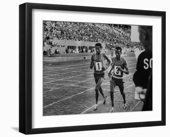 Abebe Bikila and Mamo Wolde in Exhibition Race at Berlin Olympic Stadium-null-Framed Premium Photographic Print