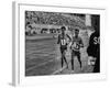 Abebe Bikila and Mamo Wolde in Exhibition Race at Berlin Olympic Stadium-null-Framed Premium Photographic Print