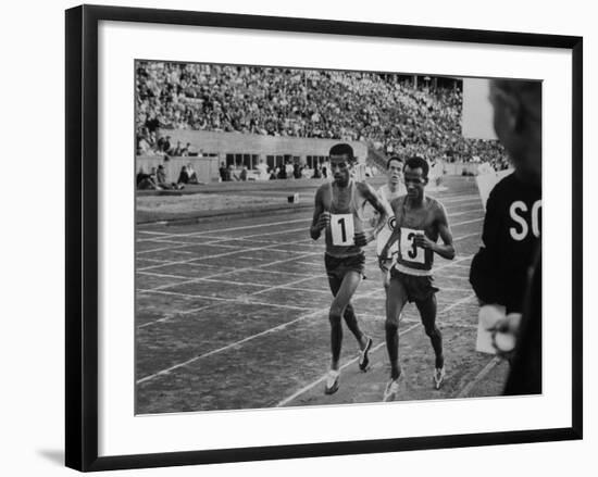 Abebe Bikila and Mamo Wolde in Exhibition Race at Berlin Olympic Stadium-null-Framed Premium Photographic Print