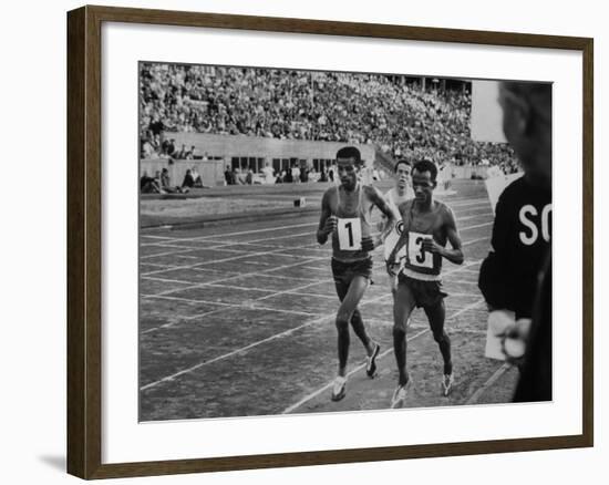 Abebe Bikila and Mamo Wolde in Exhibition Race at Berlin Olympic Stadium-null-Framed Premium Photographic Print