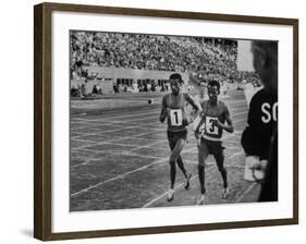 Abebe Bikila and Mamo Wolde in Exhibition Race at Berlin Olympic Stadium-null-Framed Premium Photographic Print