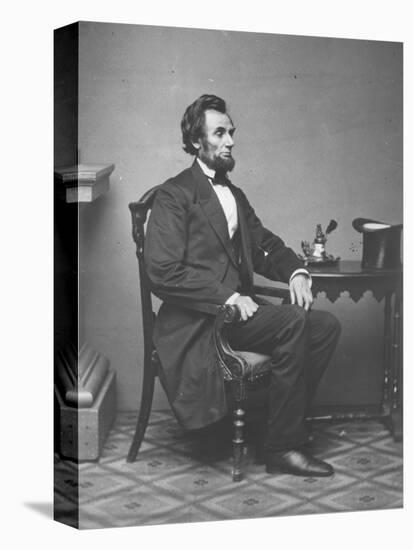 Abraham Lincoln, full-length portrait, seated, 1861-Alexander Gardner-Stretched Canvas