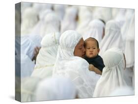 Acehnese Woman Holds a Child after Eid Al-Adha Prayer in the Tsunami-Ravaged Town of Meulaboh-null-Stretched Canvas