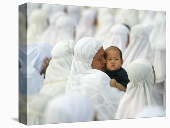 Acehnese Woman Holds a Child after Eid Al-Adha Prayer in the Tsunami-Ravaged Town of Meulaboh-null-Stretched Canvas