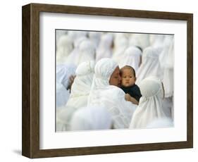 Acehnese Woman Holds a Child after Eid Al-Adha Prayer in the Tsunami-Ravaged Town of Meulaboh-null-Framed Photographic Print