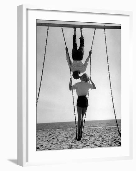 Acrobat and Actor, Russ Tamblyn on the Beach with Movie Actress Venetia Stevenson-Allan Grant-Framed Premium Photographic Print