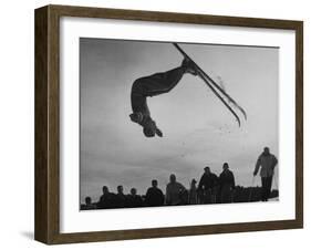 Acrobatic Skier Jack Reddish in Somersault at Sun Valley Ski Resort-J^ R^ Eyerman-Framed Photographic Print