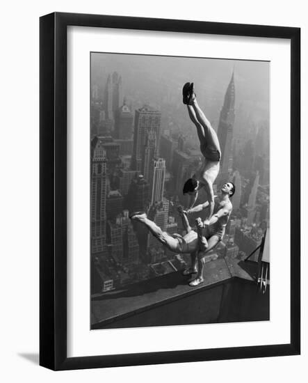 Acrobats Performing on the Empire State Building-null-Framed Premium Photographic Print