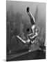 Acrobats Performing on the Empire State Building-null-Mounted Photographic Print