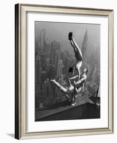 Acrobats Performing on the Empire State Building-null-Framed Photographic Print