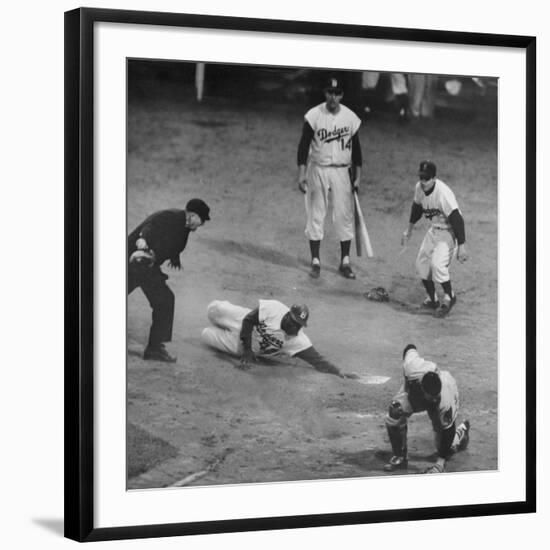 Action During a Game Between the Brooklyn Dodgers and the Milwaukee Braves at Ebbet's Field-Ralph Morse-Framed Premium Photographic Print