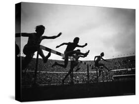 Action During the Women's 100m Hurdles at the 1952 Olympic Games in Helsinki-Mark Kauffman-Stretched Canvas